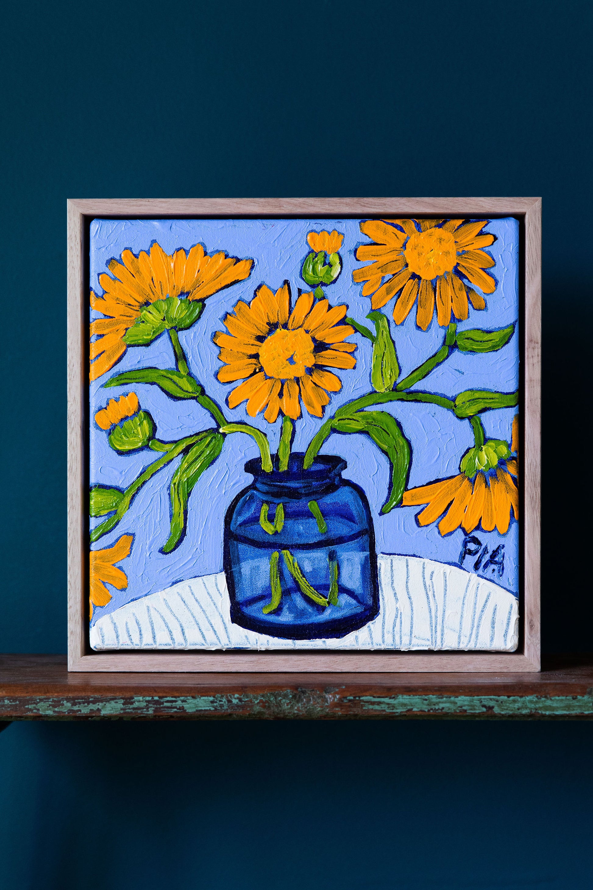 Calendula in Blue Glass by Pia Kuykhoven