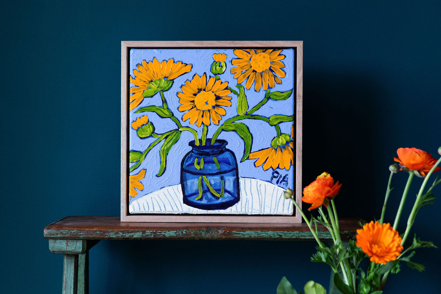 Calendula in Blue Glass by Pia Kuykhoven